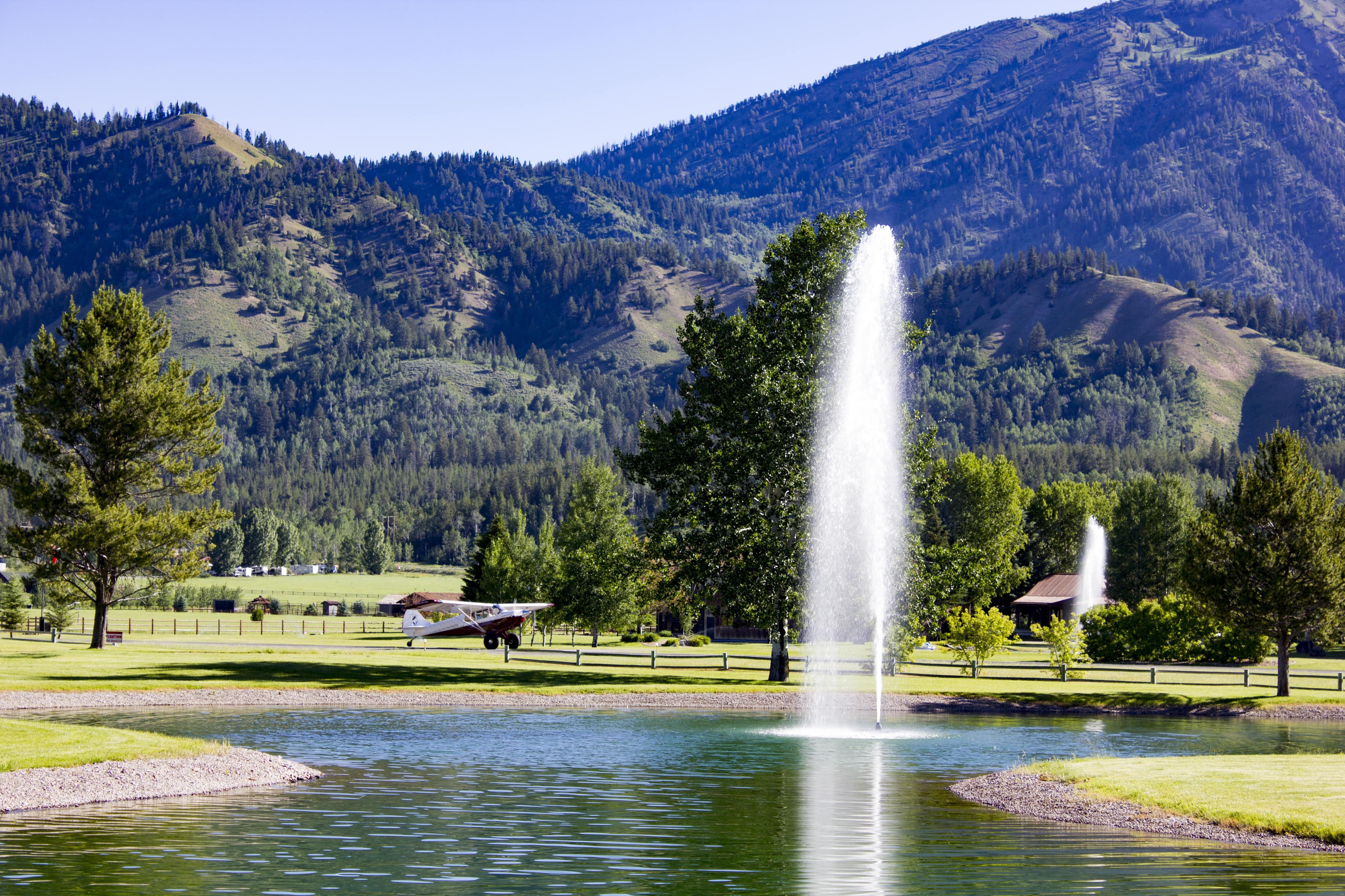 Photo showing an airplane and a fountain